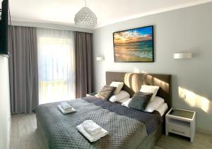 Posteľ alebo postele v izbe v ubytovaní Apartament RELAX