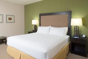 a large white bed in a hotel room at Holiday Inn Express Hotel & Suites North Sequim, an IHG Hotel in Sequim