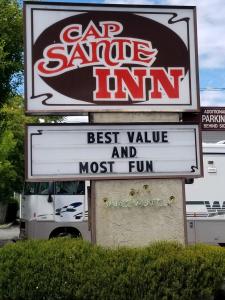 a sign for a best value and most fun store at Cap Sante Inn in Anacortes