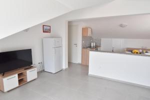 Kuchyň nebo kuchyňský kout v ubytování Sandy beach apartments