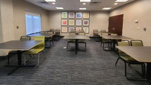 a classroom with tables and chairs in a room at Holiday Inn Express Lordstown-Newton Falls/Warren by IHG in Newton Falls