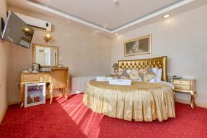 a hotel room with a bed and a desk at Twins Hotel in Ankara