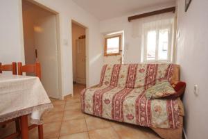 a living room with a couch and a table at Apartments Mat - great location in Vis