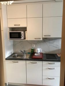 Kuchyň nebo kuchyňský kout v ubytování Apartment by Mario