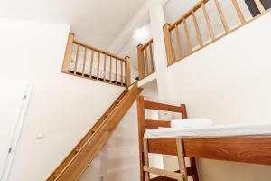 a room with two bunk beds and a staircase at Hostel Budva in Budva