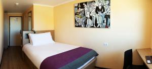 Giường trong phòng chung tại Hotel Modular Express Calama