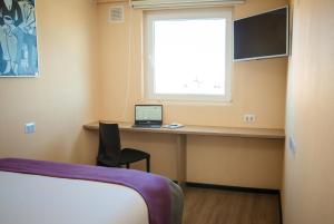 TV a/nebo společenská místnost v ubytování Hotel Modular Express Calama + 24 fotografií