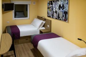 Giường trong phòng chung tại Hotel Modular Express Calama