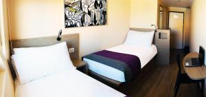 Giường trong phòng chung tại Hotel Modular Express Calama