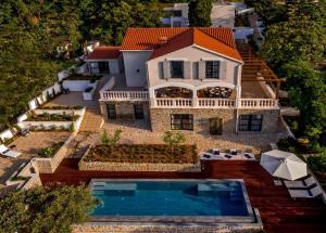 an aerial view of a house with a swimming pool at Villa Waterfront Dream A Stunning 4 Bedroom Villa Cinema Room Wine Cellar in Korčula