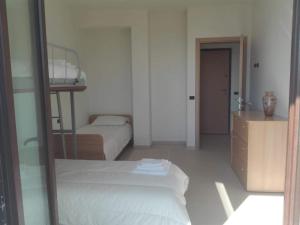 A bed or beds in a room at Villa Santoro ai TRE Ulivi con Piscina Privata