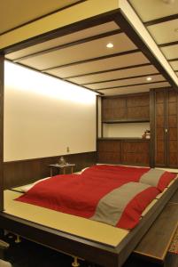 Säng eller sängar i ett rum på Yamakikan