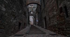 un callejón con escaleras en un antiguo edificio de piedra en Asso Residence Narni en Narni