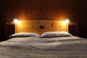 Postel nebo postele na pokoji v ubytování Hotel La Piccola Baita + 26 fotografií