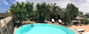 an overhead view of a swimming pool at a resort at Le casette di Marilena b&b Agave Iucca in Pantelleria