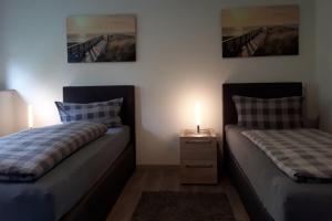 Postel nebo postele na pokoji v ubytování C&C Gästehaus Bückeburg