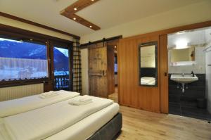 Katil atau katil-katil dalam bilik di Pension & Apartments Weissbriach