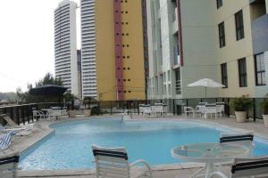 Piscina en o cerca de Flat 2 Quartos Com Vista Para o Mar e Serviços Hoteleiros