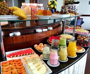a table topped with lots of different types of food at Wynn Batel in Curitiba