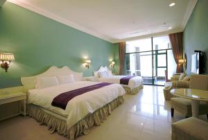 Ένα ή περισσότερα κρεβάτια σε δωμάτιο στο Muen Hot Spring Hotel
