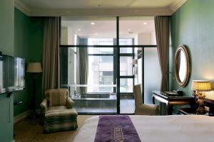 Ένα ή περισσότερα κρεβάτια σε δωμάτιο στο Muen Hot Spring Hotel