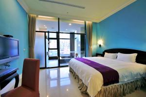 Ένα ή περισσότερα κρεβάτια σε δωμάτιο στο Muen Hot Spring Hotel