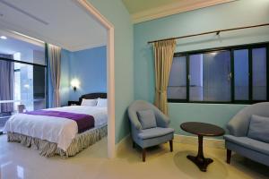 Ένα ή περισσότερα κρεβάτια σε δωμάτιο στο Muen Hot Spring Hotel
