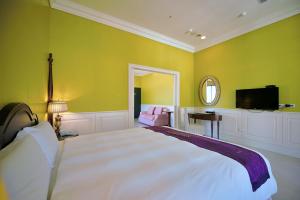 Ένα ή περισσότερα κρεβάτια σε δωμάτιο στο Muen Hot Spring Hotel