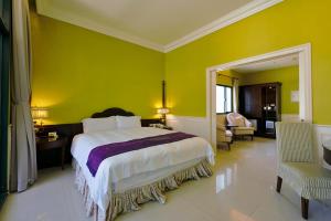 Ένα ή περισσότερα κρεβάτια σε δωμάτιο στο Muen Hot Spring Hotel