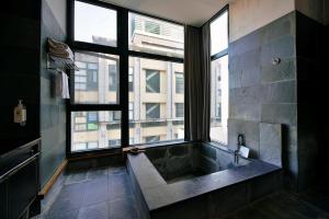 Ένα ή περισσότερα κρεβάτια σε δωμάτιο στο Muen Hot Spring Hotel