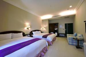 Ένα ή περισσότερα κρεβάτια σε δωμάτιο στο Muen Hot Spring Hotel