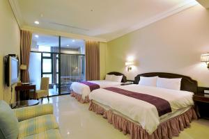 Ένα ή περισσότερα κρεβάτια σε δωμάτιο στο Muen Hot Spring Hotel