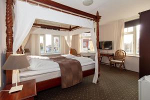 Voodi või voodid majutusasutuse Foldens Hotel toas