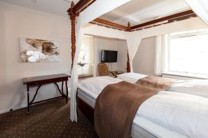 Voodi või voodid majutusasutuse Foldens Hotel toas