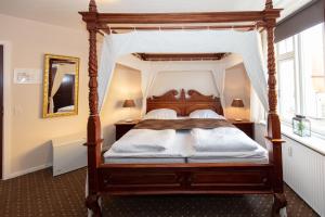 Voodi või voodid majutusasutuse Foldens Hotel toas
