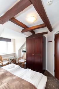 Voodi või voodid majutusasutuse Foldens Hotel toas