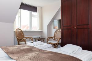 Voodi või voodid majutusasutuse Foldens Hotel toas