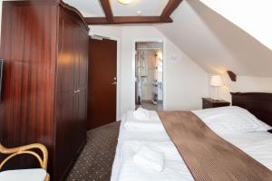 Voodi või voodid majutusasutuse Foldens Hotel toas