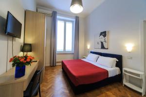 A bed or beds in a room at Spaccanapoli Comfort Suites