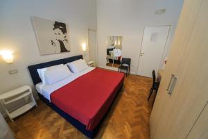 A bed or beds in a room at Spaccanapoli Comfort Suites