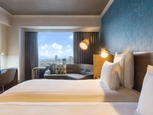 Ein Bett oder Betten in einem Zimmer der Unterkunft Swissotel Nankai Osaka