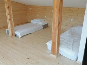 Łóżko lub łóżka w pokoju w obiekcie Rezerwat Wielin