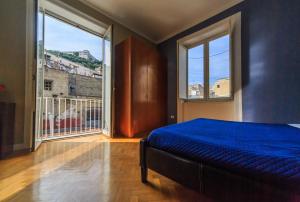 A bed or beds in a room at Spaccanapoli Comfort Suites