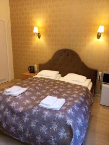 Postel nebo postele na pokoji v ubytování Taurus Apartments Vilnius