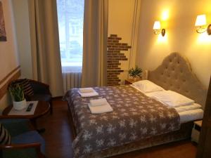 Postel nebo postele na pokoji v ubytování Taurus Apartments Vilnius