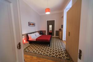 A bed or beds in a room at Spaccanapoli Comfort Suites