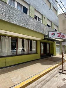a store front of a building with a window at Hotel Roma in Mar de Ajó