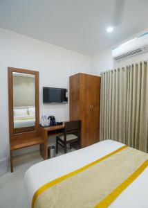 Postel nebo postele na pokoji v ubytování Hotel Laxmi Cityside