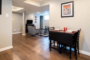 a dining room and living room with a table and chairs at The Lewis House in Laramie