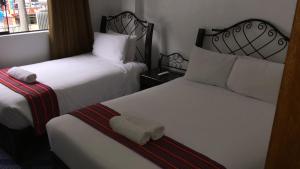 Voodi või voodid majutusasutuse Hotel Machupicchu Inn toas
